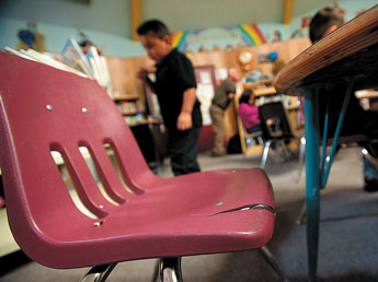Seats in the Red Rock Elementary school library have cracked and are pinching student's legs.  © 2011 Gallup Independent / Adron Gardner 